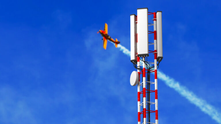 Closeup aerial view around of the telecommunication tower.